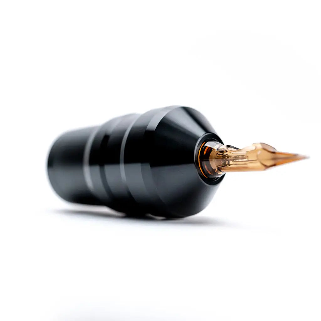 Black Acus C2 tattoo machine with a gold-colored needle tip designed for precise and professional ink application