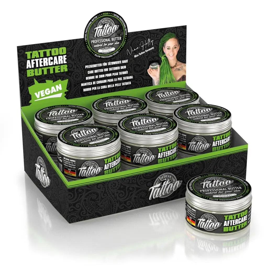 Schwarze und grün beschriftete Dosen mit silbernem Deckel von BELIEVA Tattoo Professional Butter Tattoo Aftercare Balm 100ml