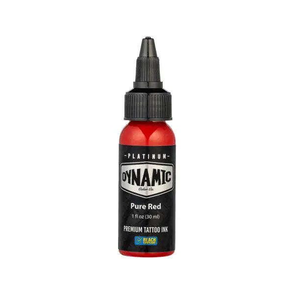 A vibrant red glossy plastic bottle of dynamic platinum pure red tattoo ink with a black screw-on cap and label