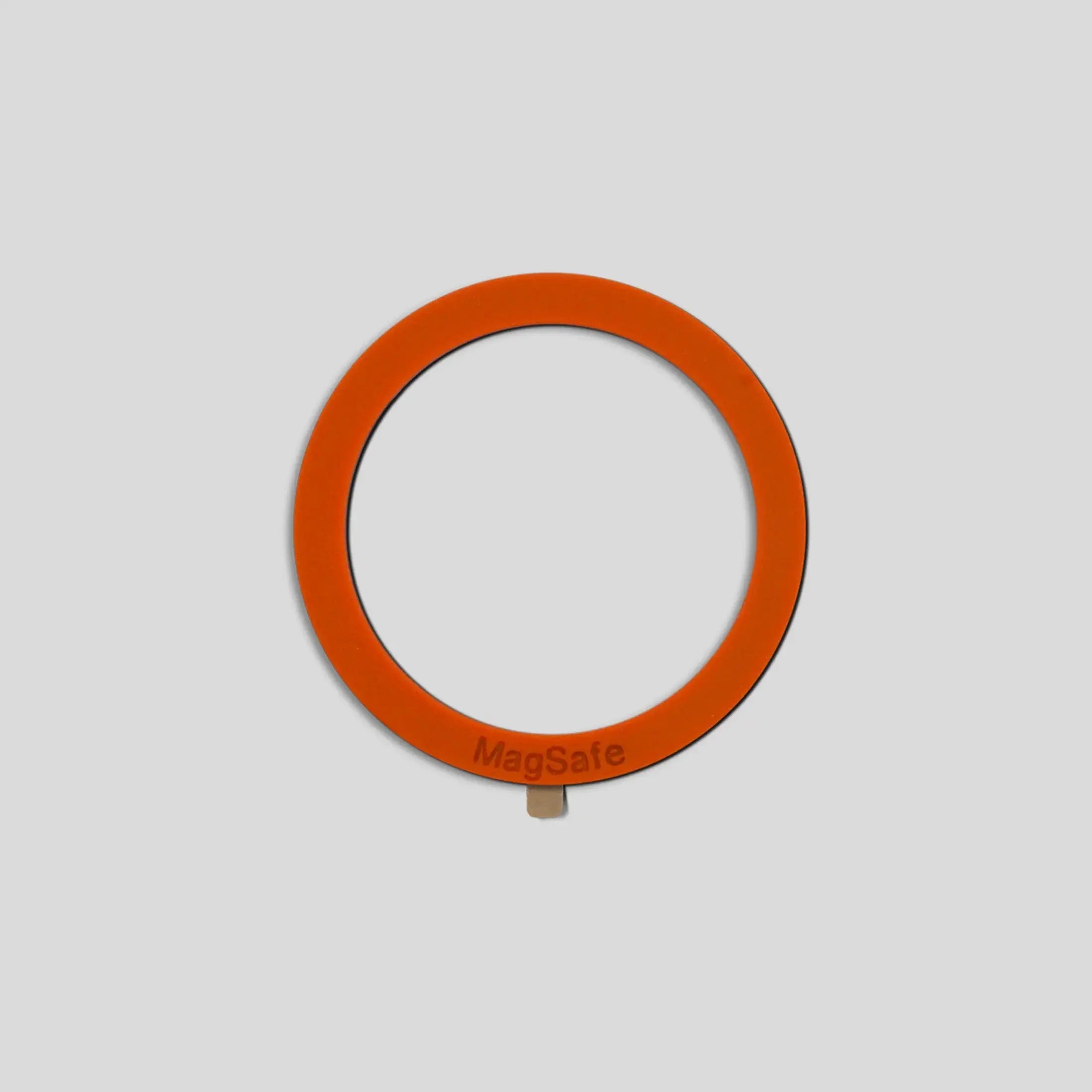Orange circular MagSafe ring with a metallic tab on the bottom for the GOAT G8 upgrade kit accessory