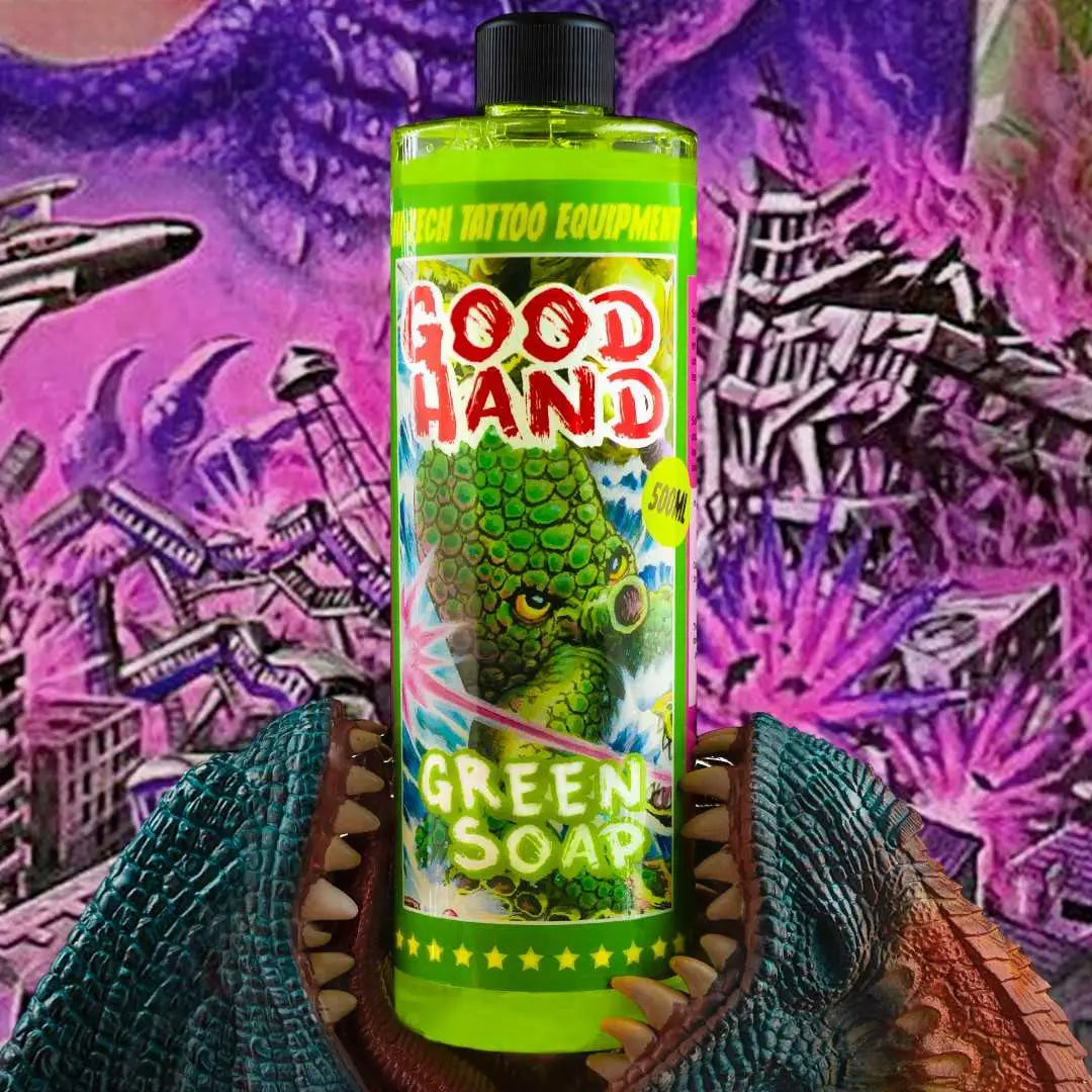 A vibrant green bottle of GOOD HAND green soap concentrate with a reptilian face label and black cap