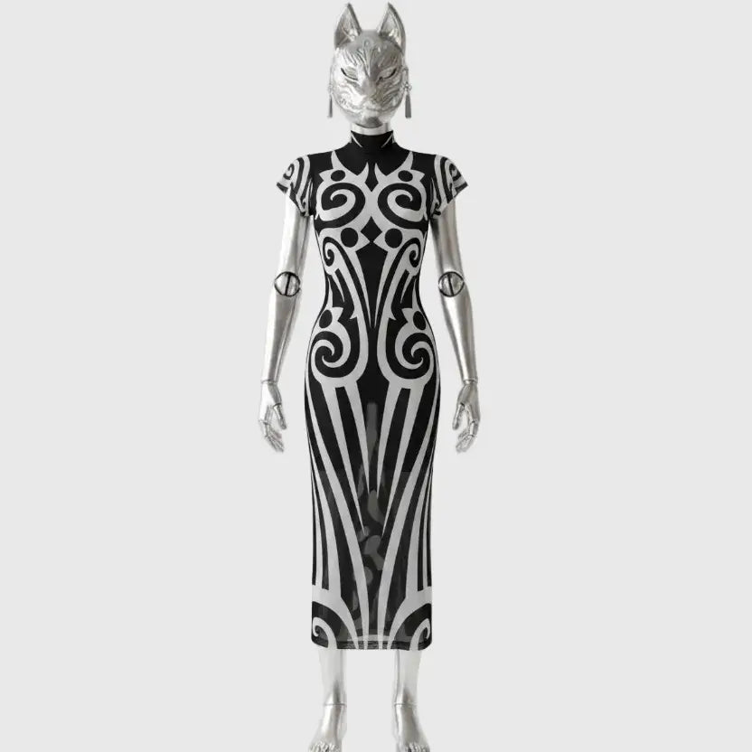 Silver figure in black dress with white tribal ornaments