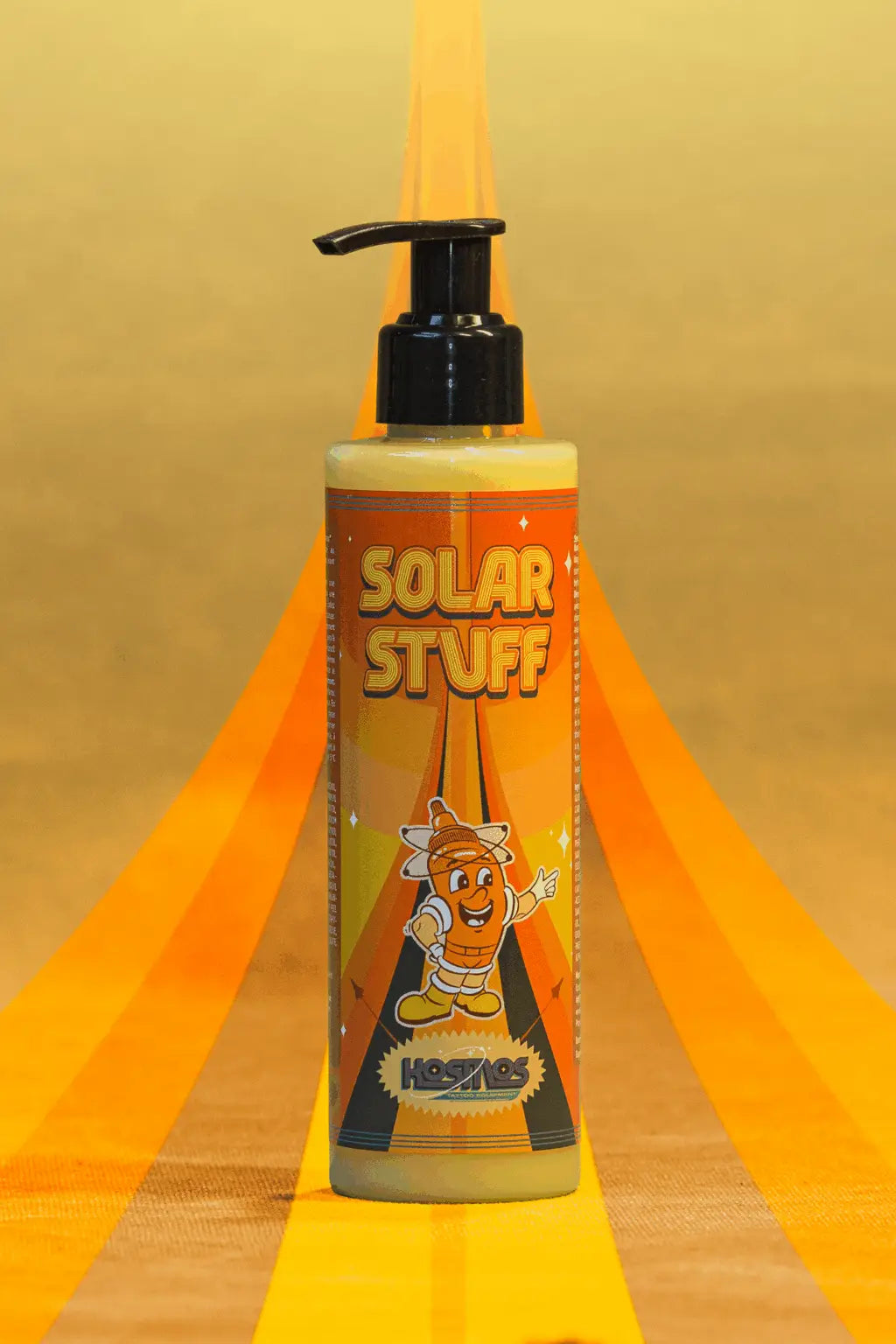 Orange-labeled pump bottle of Kosmos Solar Stuff body wash featuring a cartoon sun character for daily use