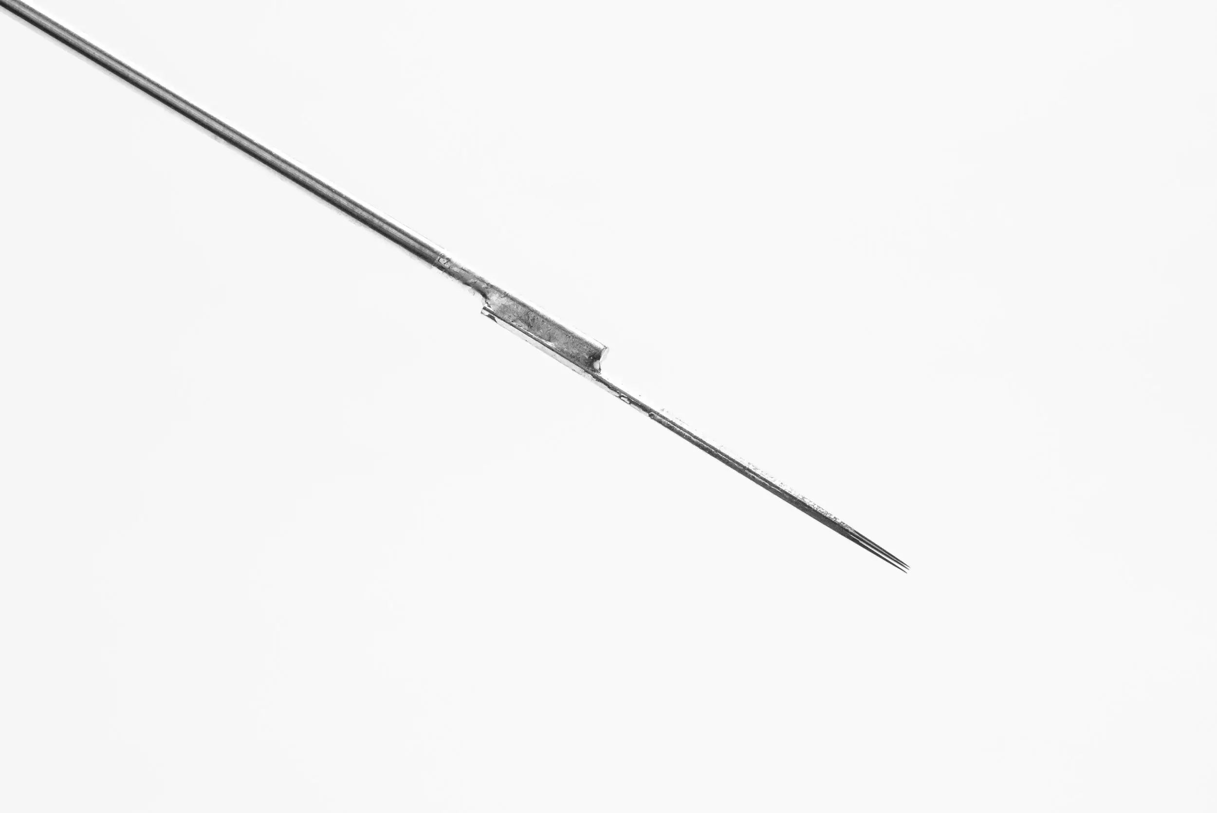 A slender metallic needle with sharp point and smooth shaft from lotus bar needles round liner standard liner