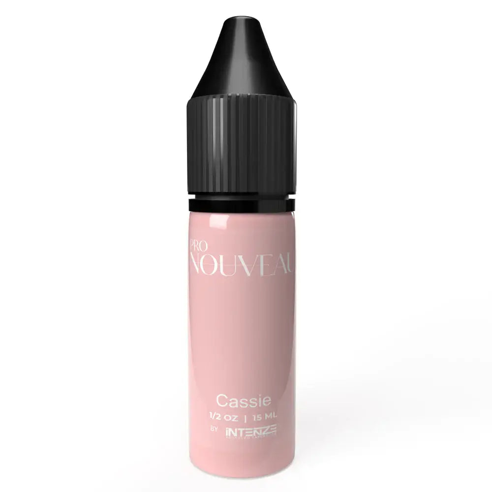 A sleek translucent pink pmu pigment bottle with black ribbed cap labeled cassie by intenza from the blush collection