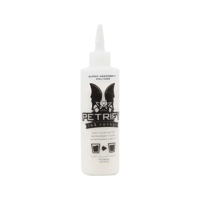 White plastic bottle with white nozzle labeled petrify ink sponge super absorbent polymer for water-based liquid cleanup
