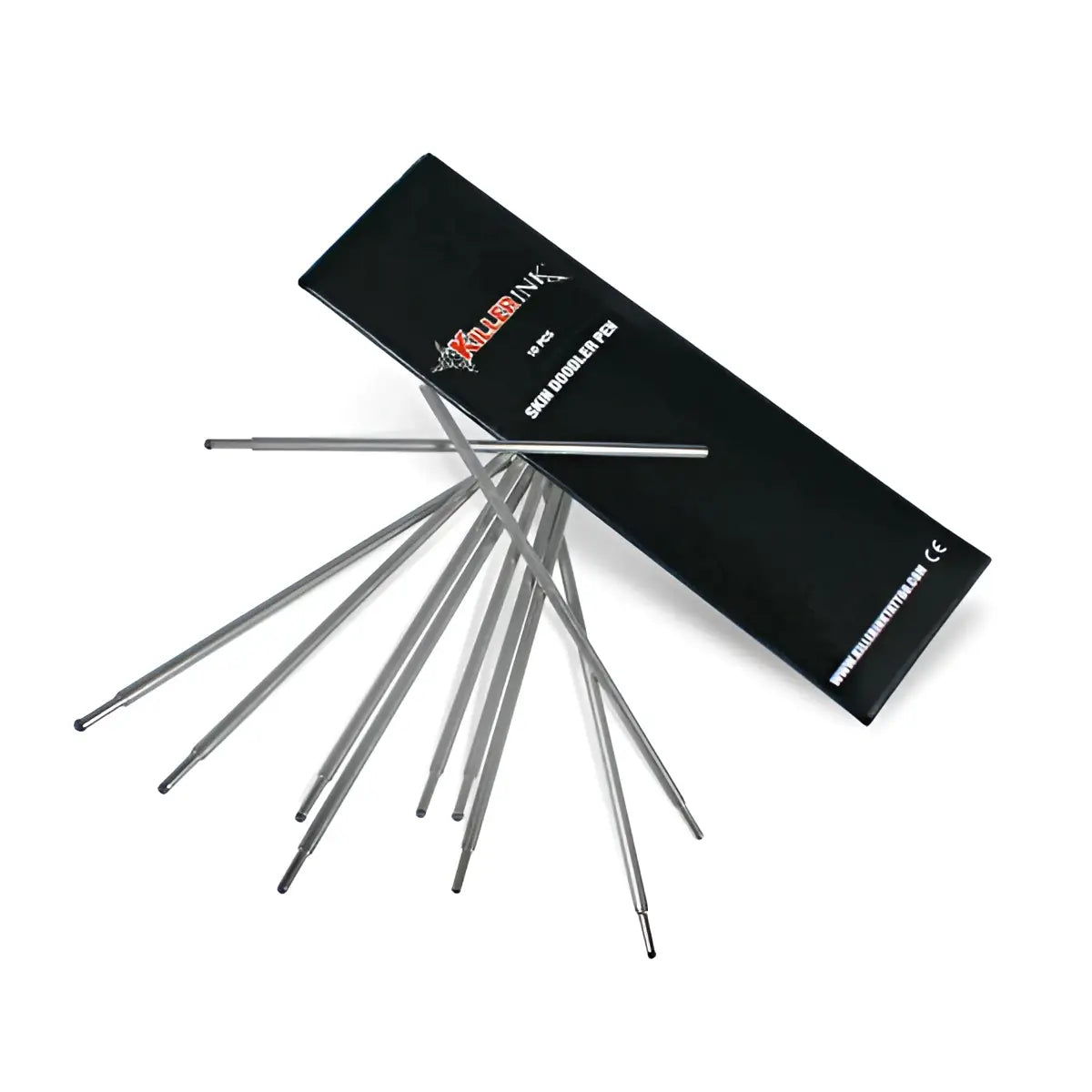 Black rectangular killer ink box with silver dermograph pen needles fanned beside it for skin doodlers skin surfer pens