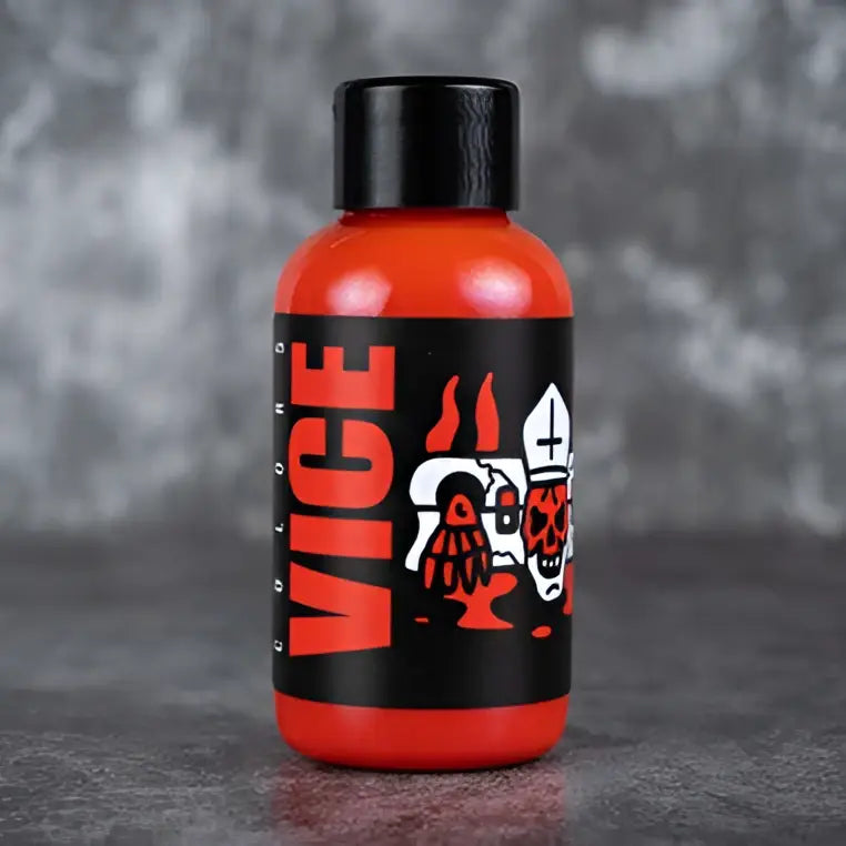 Vice burning red orange liquid bottle with black cap and skull graphic label for vaping use
