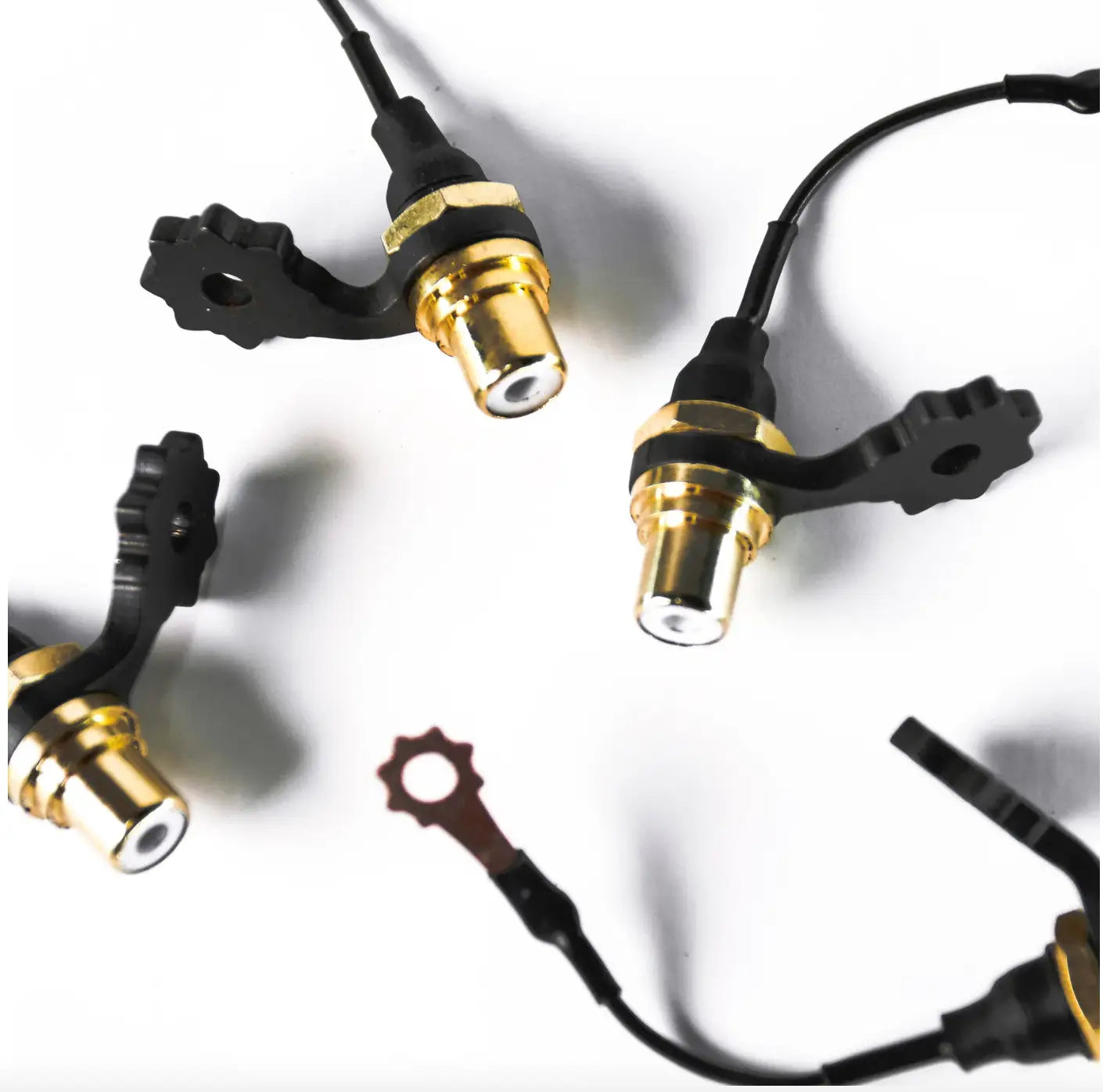 Vlad blad rca adapter for coils with black and gold automotive crankshaft position sensor and gear-shaped mounting bracket