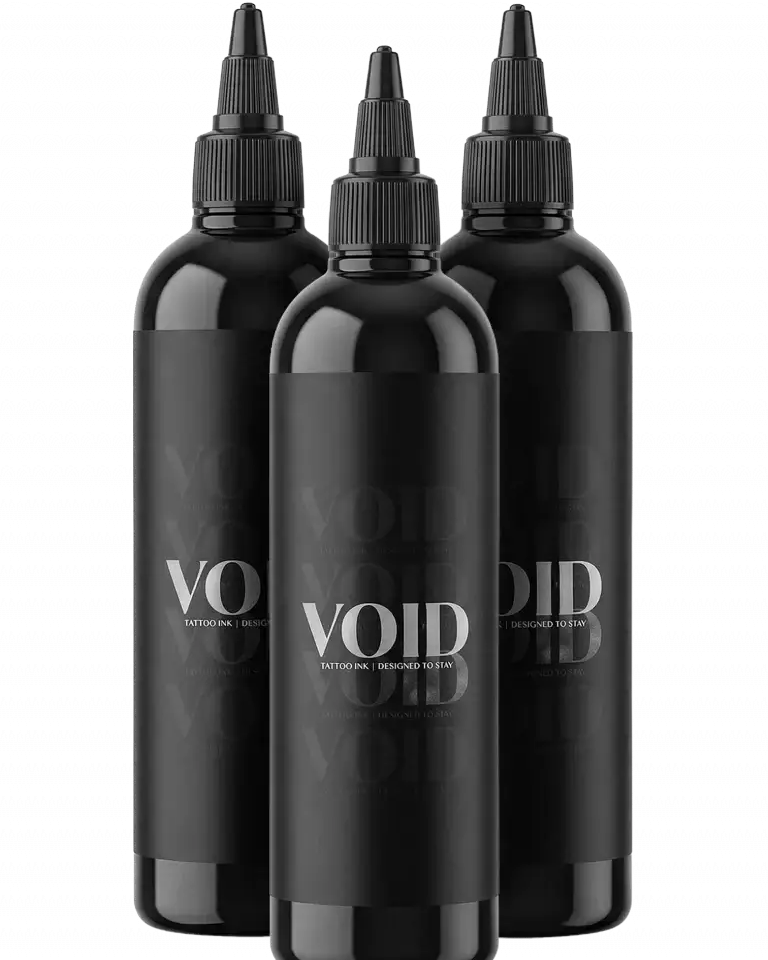 Three sleek black plastic bottles of void tattoo ink black tattoo ink with minimalist white branding and pigment structure