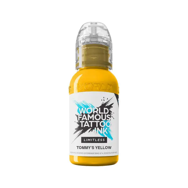 A vibrant yellow world famous limitless tattoo ink bottle with a clear plastic cap and bold black text label