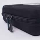 Black textured hard-shell case with zipper and dark green fabric pull tabs for acus m1 ayre product storage
