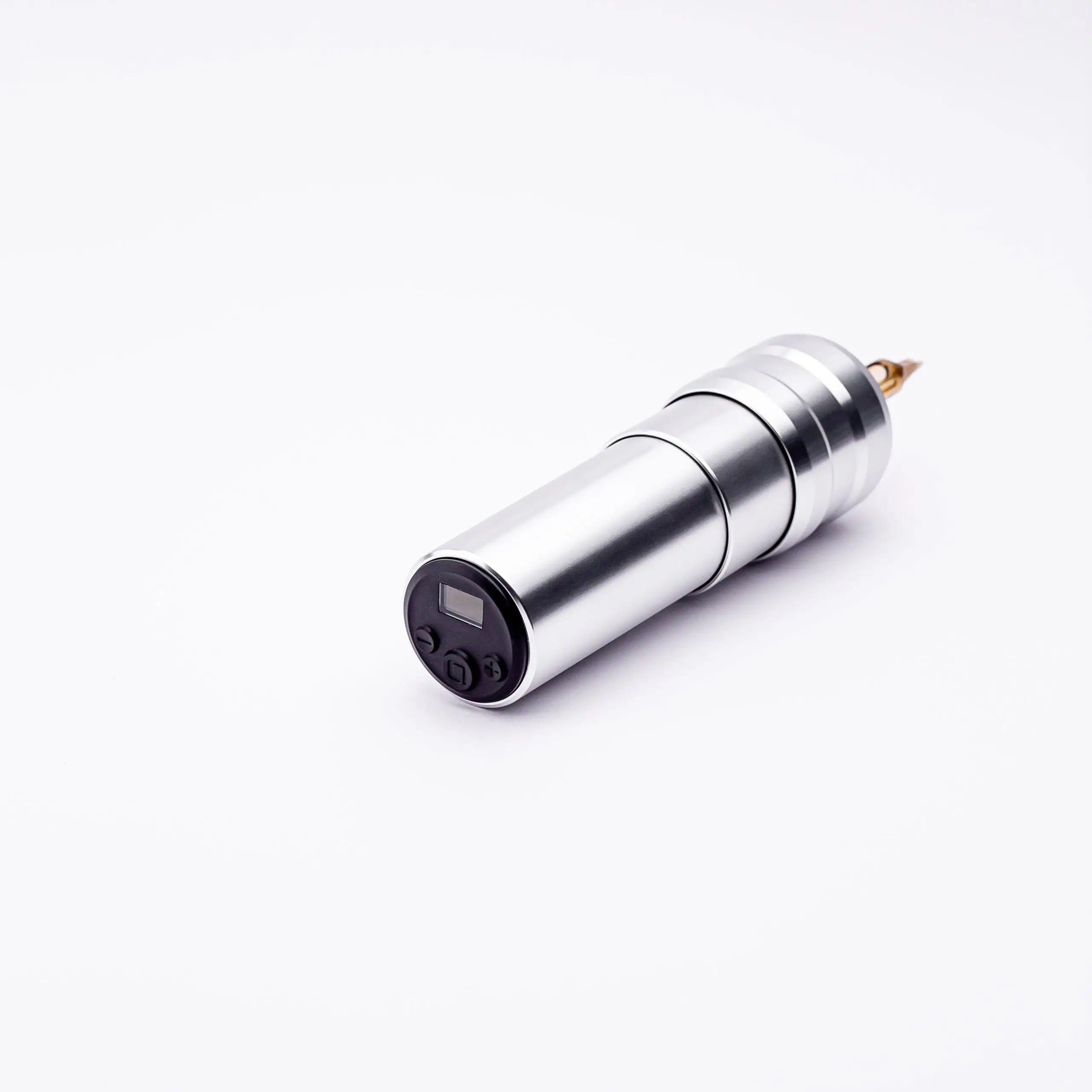 Silver cylindrical ACUS M1 Ayre tattoo machine with black control panel and gold-colored needle tip for precise tattooing