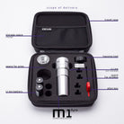 Silver cylindrical wireless tattoo machine with textured grip and threaded barrel branded Acus M1 Ayre