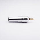Silver metallic ACUS - M1 Ayre tattoo machine with gold-colored needle tip for precise tattooing
