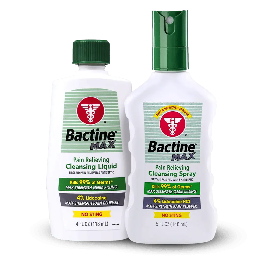 Two white plastic bottles of bactine max pain relieving cleansing spray with green screw cap and spray nozzle