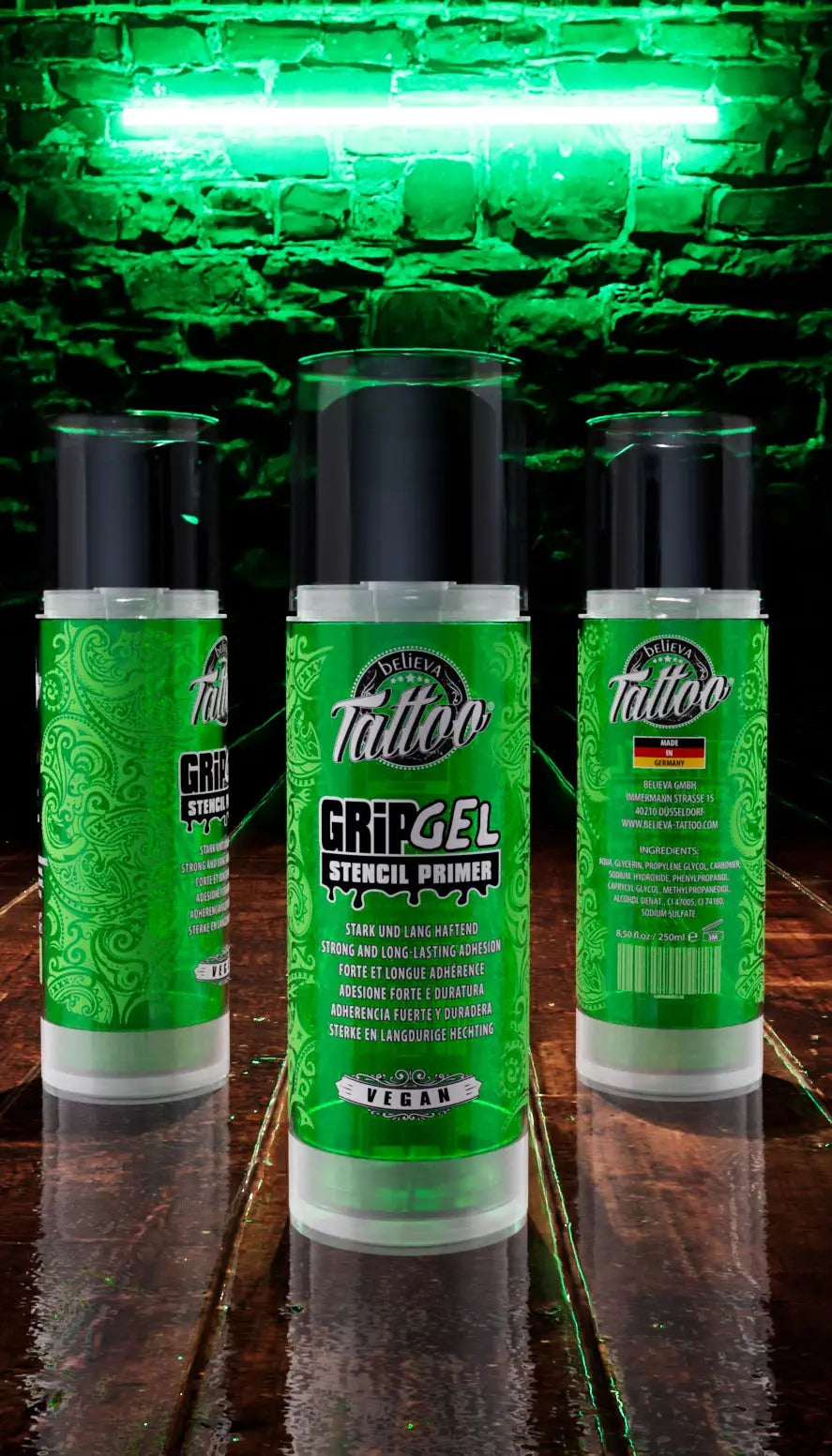 Green cylindrical BELIEVA tattoo grip gel stencil primer bottles with black caps and paisley design labels 250ml