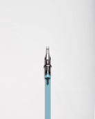 A sleek translucent teal blaze cartridges magnum tattoo needle with metallic tip and black grip for precision ink work