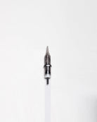 A sleek metallic round liner tattoo needle with sharp tip and black plastic components from Blaze Cartridges