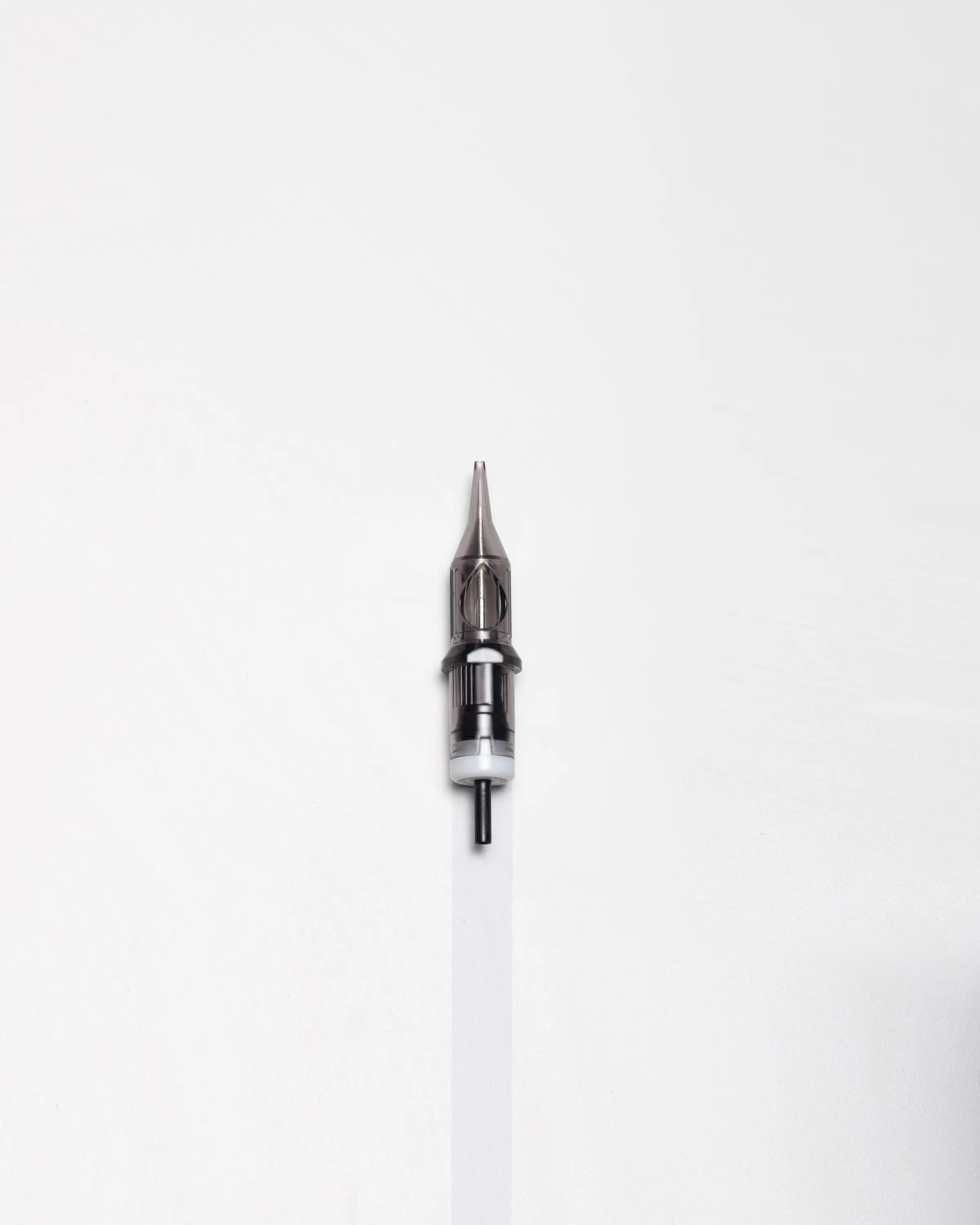 A sleek metallic black plastic blaze cartridges round liner tattoo needle with a sharp tip for precise inking