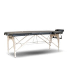 Table de massage noire rembourrée avec cadre en métal blanc et appuie-tête réglable pour usage locatif, modèle caos nero