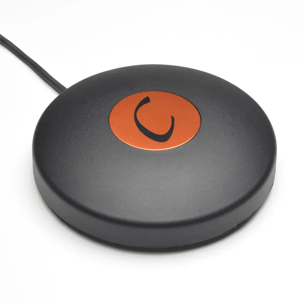 Cheyenne footswitch black circular wireless charging pad with orange center and black power symbol