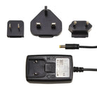 Schwarzer Reiseadapter aus Kunststoff mit austauschbaren Steckeraufsätzen und gewickeltem Netzkabel für CHEYENNE-Wandnetzteile PU I+II HAWK SOL