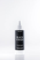 COAL BLACK schwarzes Tattoo-Finishing-Spray in einer eleganten transparenten Flasche mit weißer Düse und schwarzem Etikett