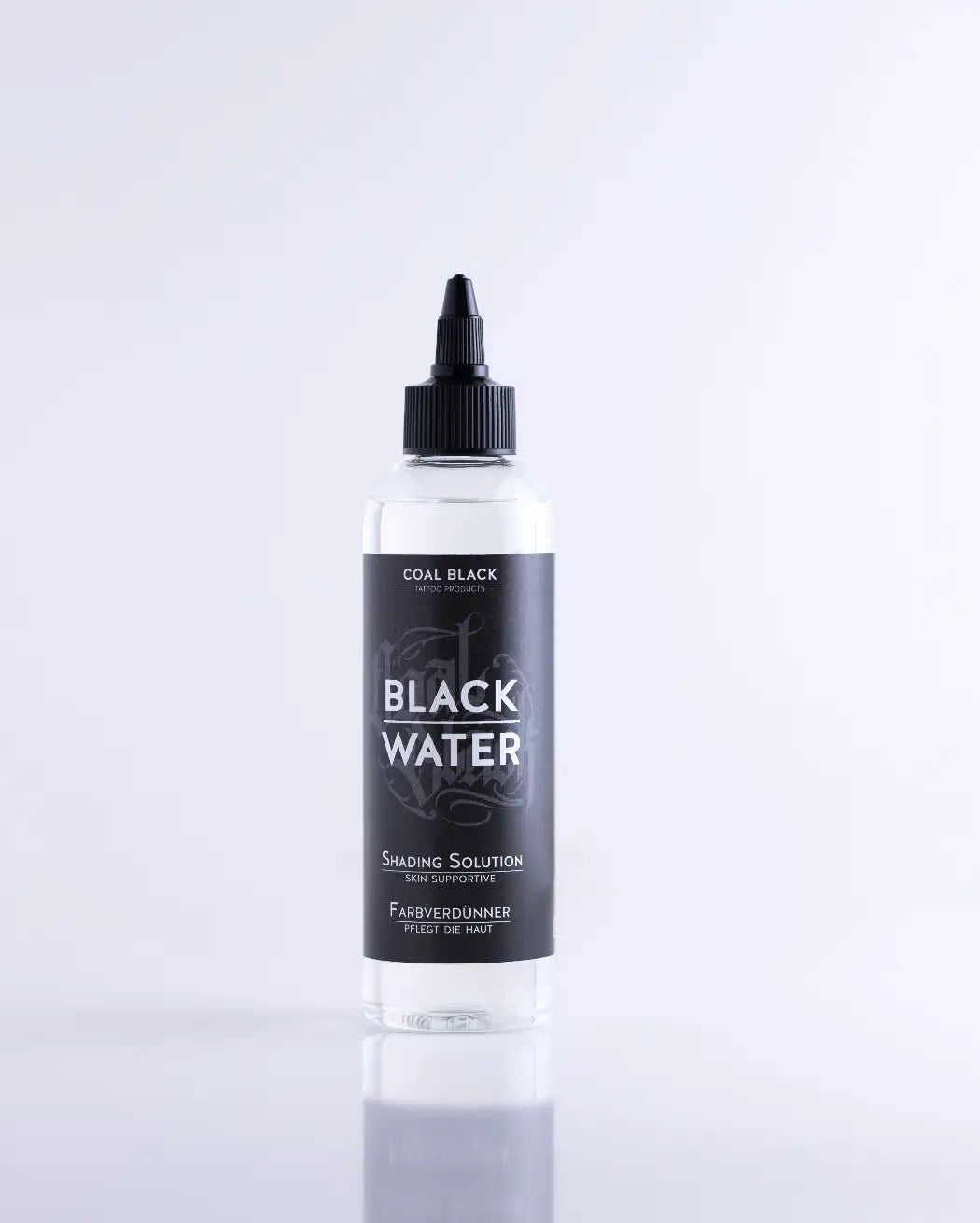 Clear plastic bottle with black cap and label featuring black water text for coal black black water product