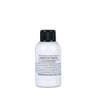 A sleek white artist pigment bottle with a black ribbed cap labeled smooth white by Dermaglo UK Ltd