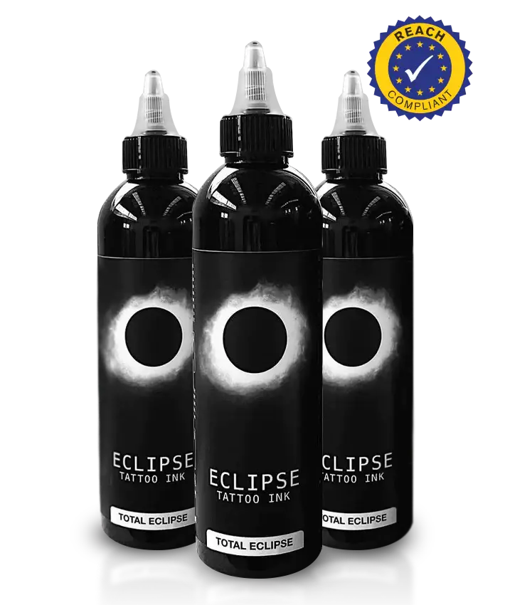 Three black bottles of eclipse total eclipse tattoo ink with white eclipse design and clear dropper caps