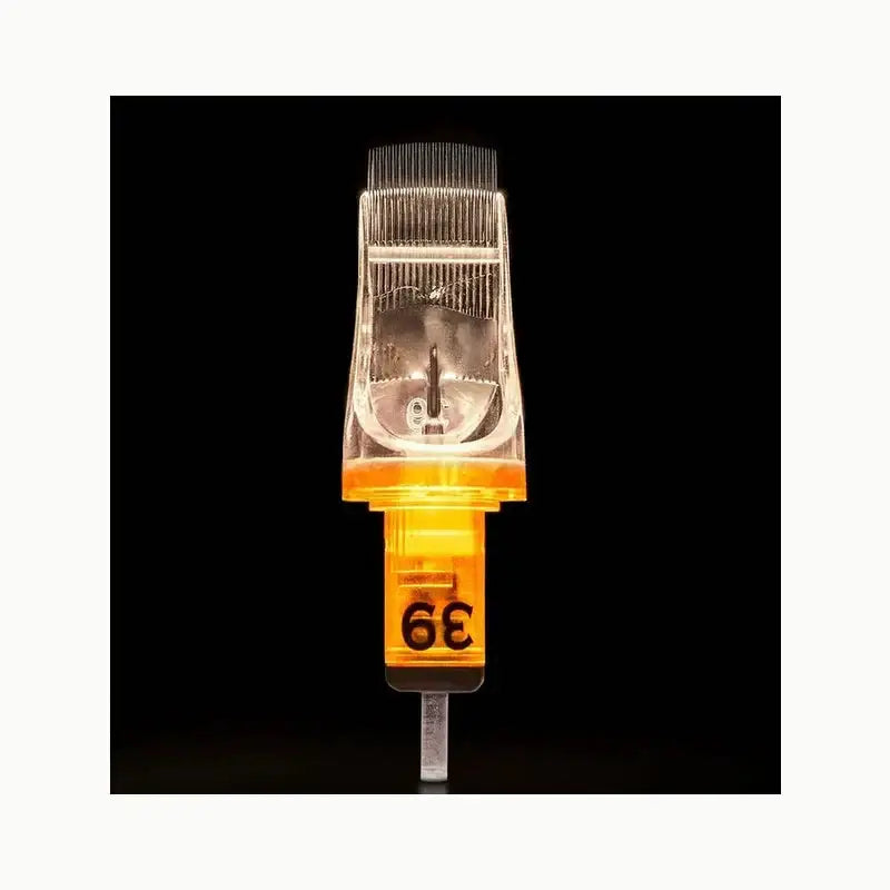 Transparent orange-tinted edge pro tattoo needle cartridge with metallic tip and fine evenly spaced prongs for magnum use