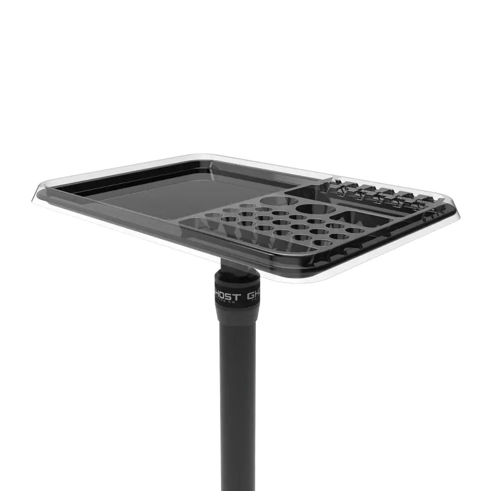 Black plastic disposable tray ghost standard v2 with multiple circular indentations mounted on a stand