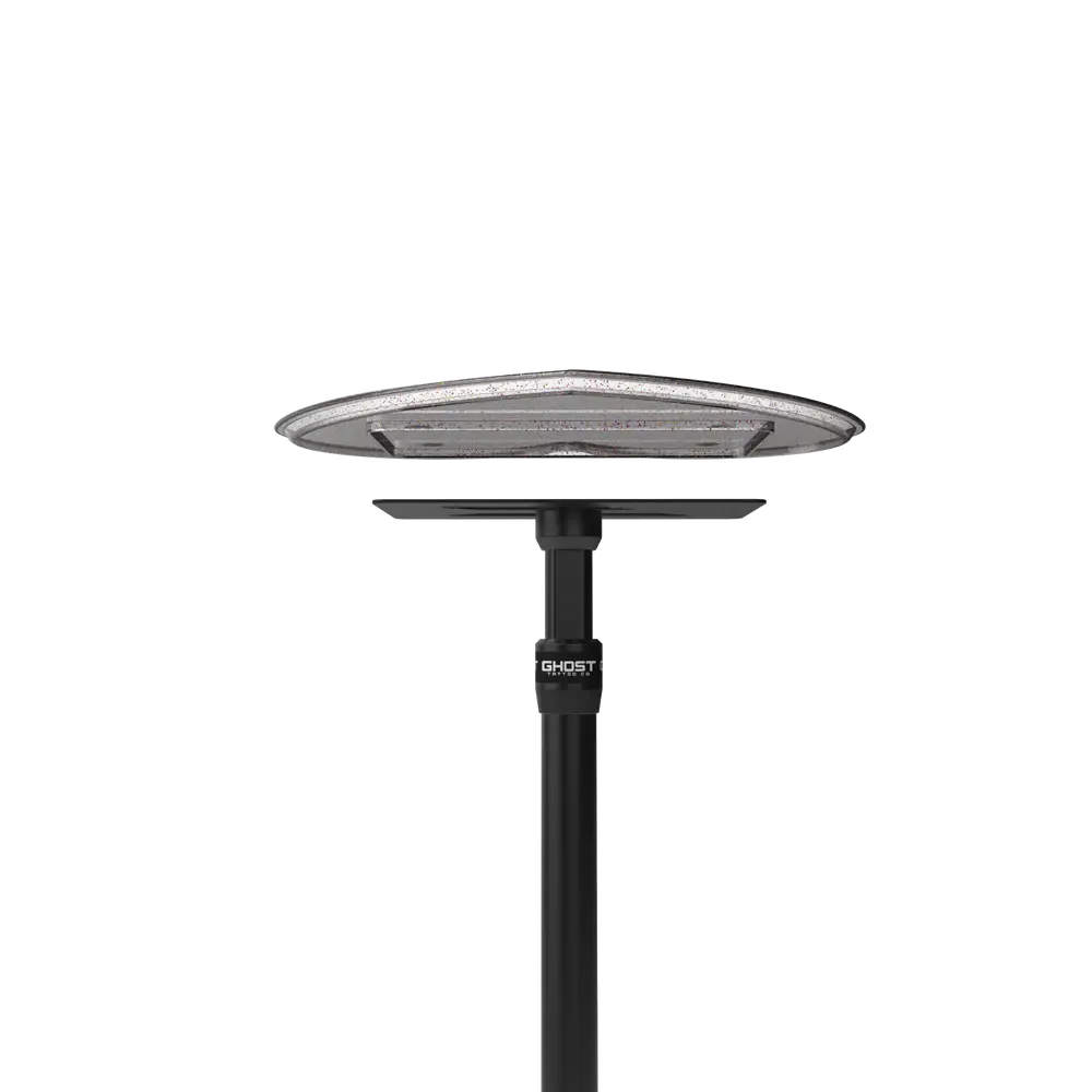 Black ghost brand outdoor solar table lamp with sleek circular led light head and sturdy pole in ghost heart tray top