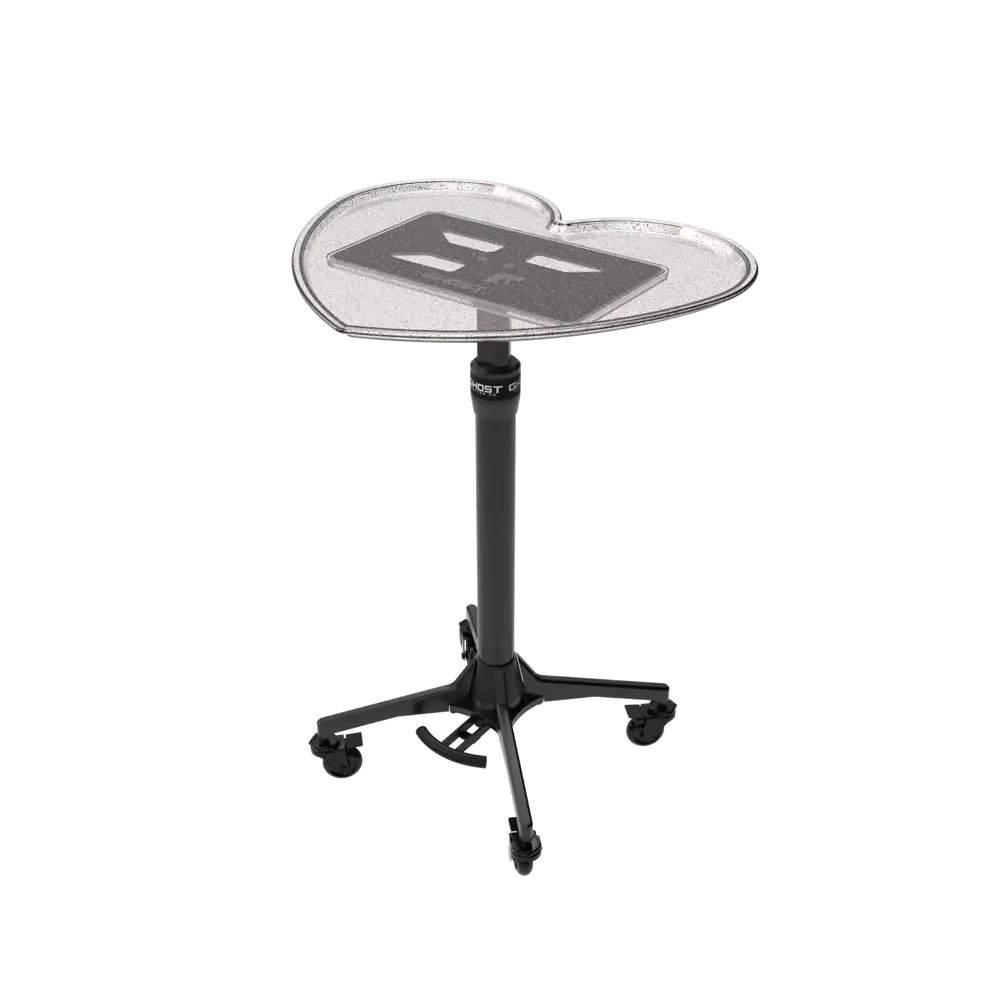 Clear heart-shaped acrylic tablet stand with black platform, adjustable height, and casters for mobility ghost heart tray top