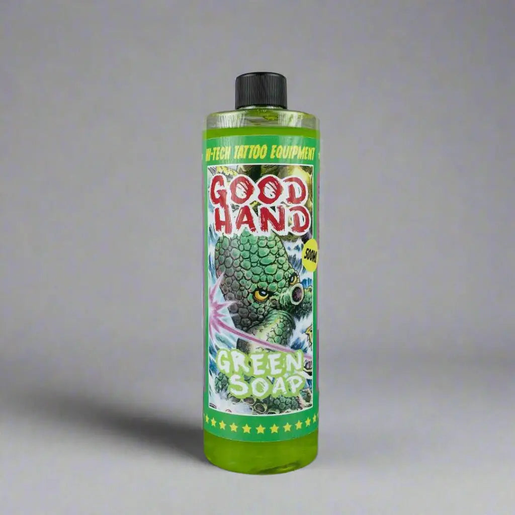 Green soap concentrate in a transparent bottle with black cap and green monster label by w-tech tattoo equipment