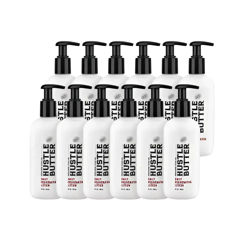 White plastic bottles with black pump dispensers featuring hustle butter deluxe daily rejuvenating lotion branding