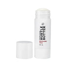 White cylindrical hustle butter deluxe revitalizing stick with white cap and black red label for skin care 45 g
