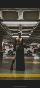 Back view of kalu ibiza black long-sleeved ibiza dj dress with high slit and intricate tattooed design showcasing vice attitude