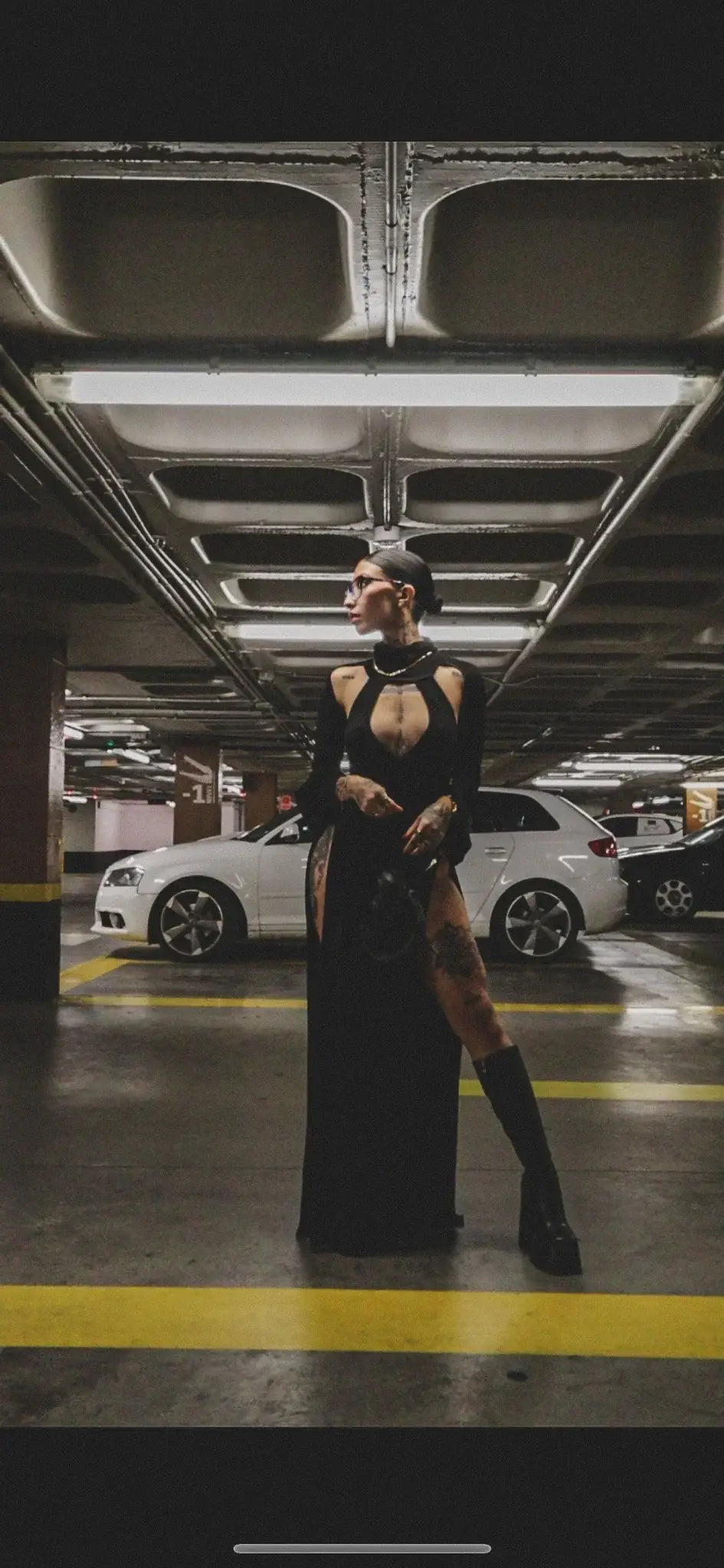 Black long-sleeved high-cut kalu ibiza ibiza dj dress with halter neckline and cut-out details by bikini goat