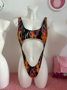 Kalu ibiza flames trikini in black orange and red features a vibrant flame pattern and bold cutout design with vice attitude
