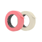 Zwei Rollen killer ink Papierklebeband in kräftigem Pink und Offwhite mit schwarz gemustertem Kern für Malerarbeiten