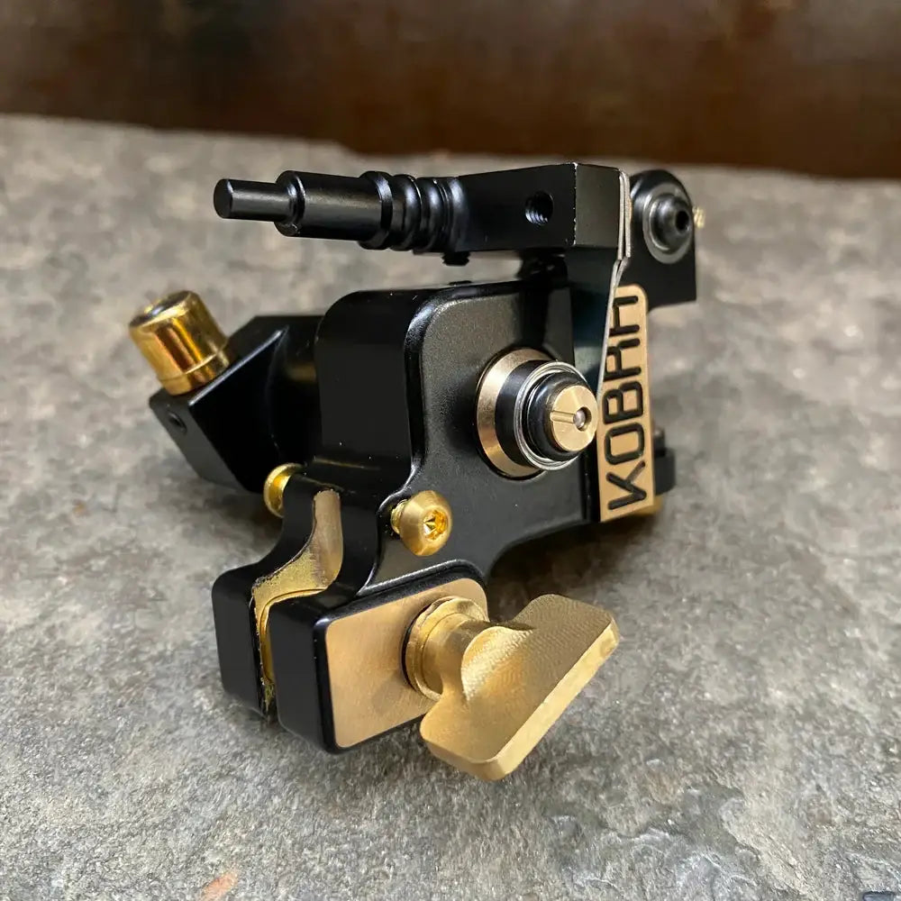 Black and gold koban tattoo machine kobral irons liner 02r with sleek industrial design for precise lining