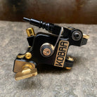 Black and gold kobra irons liner 02r tattoo machine with metallic accents designed for precision lining
