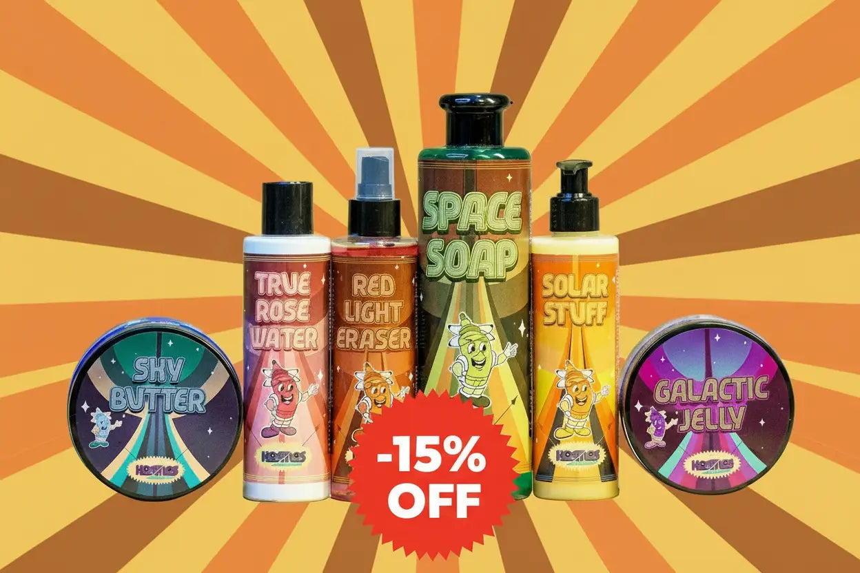 The colorful cartoon-themed bath and body products from hozelock in the kosmos full product set with sunburst background