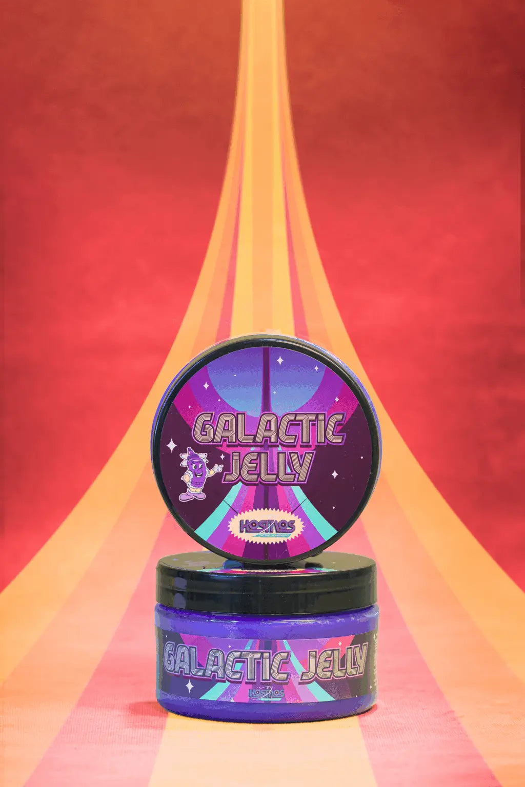 Purple and black cylindrical container of kosmos galactic jelly with a colorful space themed label featuring stars