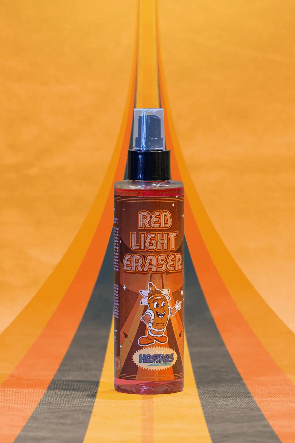 Red liquid in a clear spray bottle with black nozzle labeled red light eraser by hozelock for kosmos use