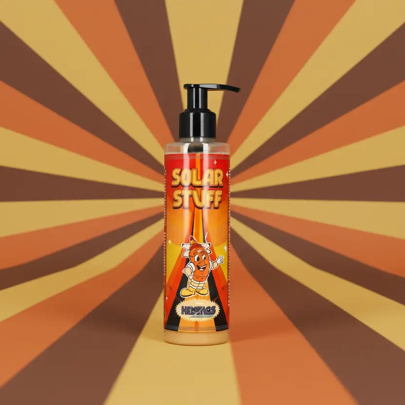 A clear plastic bottle with black pump labeled solar stuff in orange featuring a cartoon character by kosmos