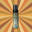 A transparent bottle with a black pump labeled space foam featuring a cartoon astronaut mascot from hostess kosmos product
