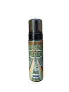 A transparent kosmos space foam bottle with a black pump and a green labeled astronaut mascot by hostess